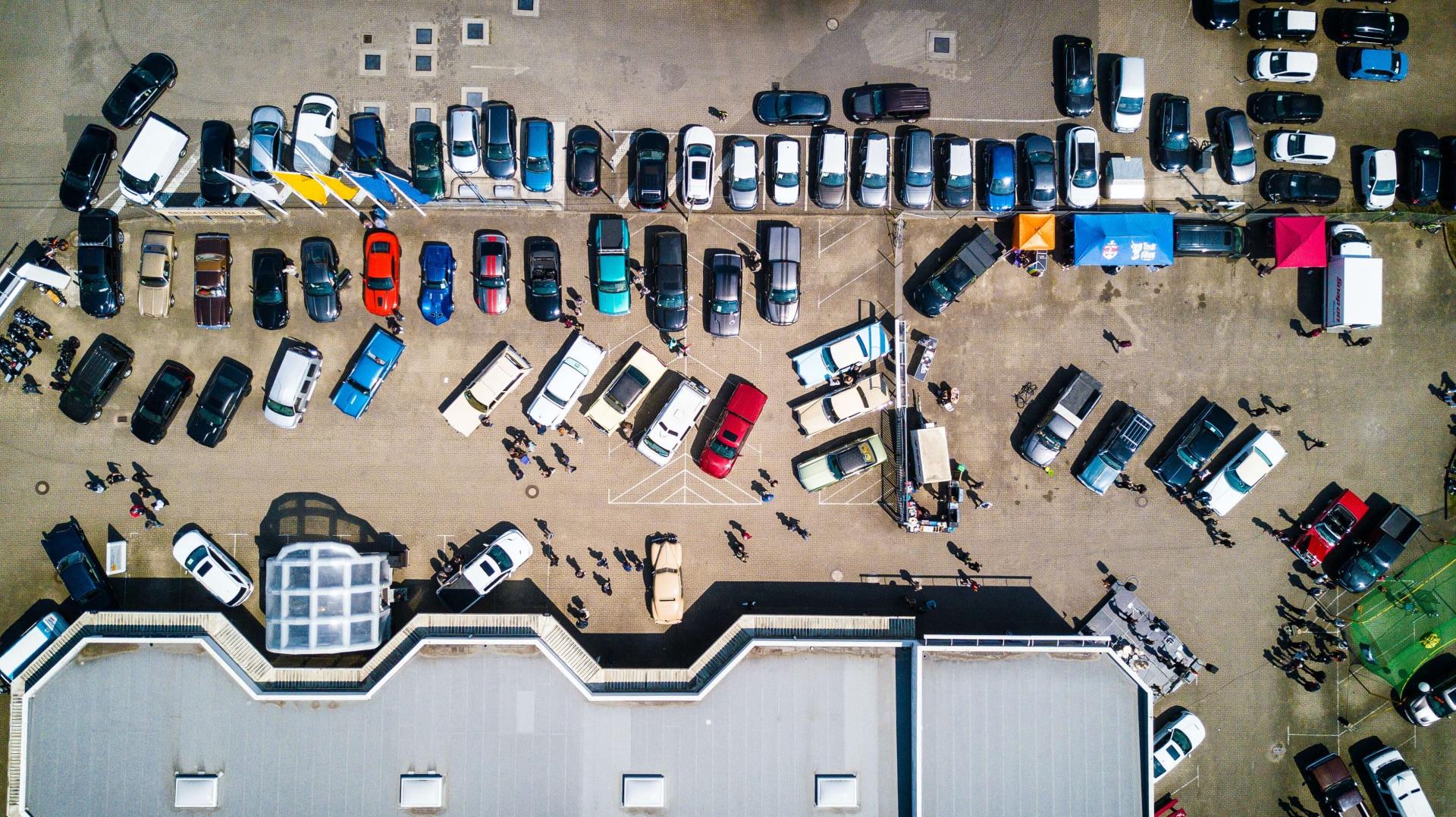 Arial shot of various cars in a car park
