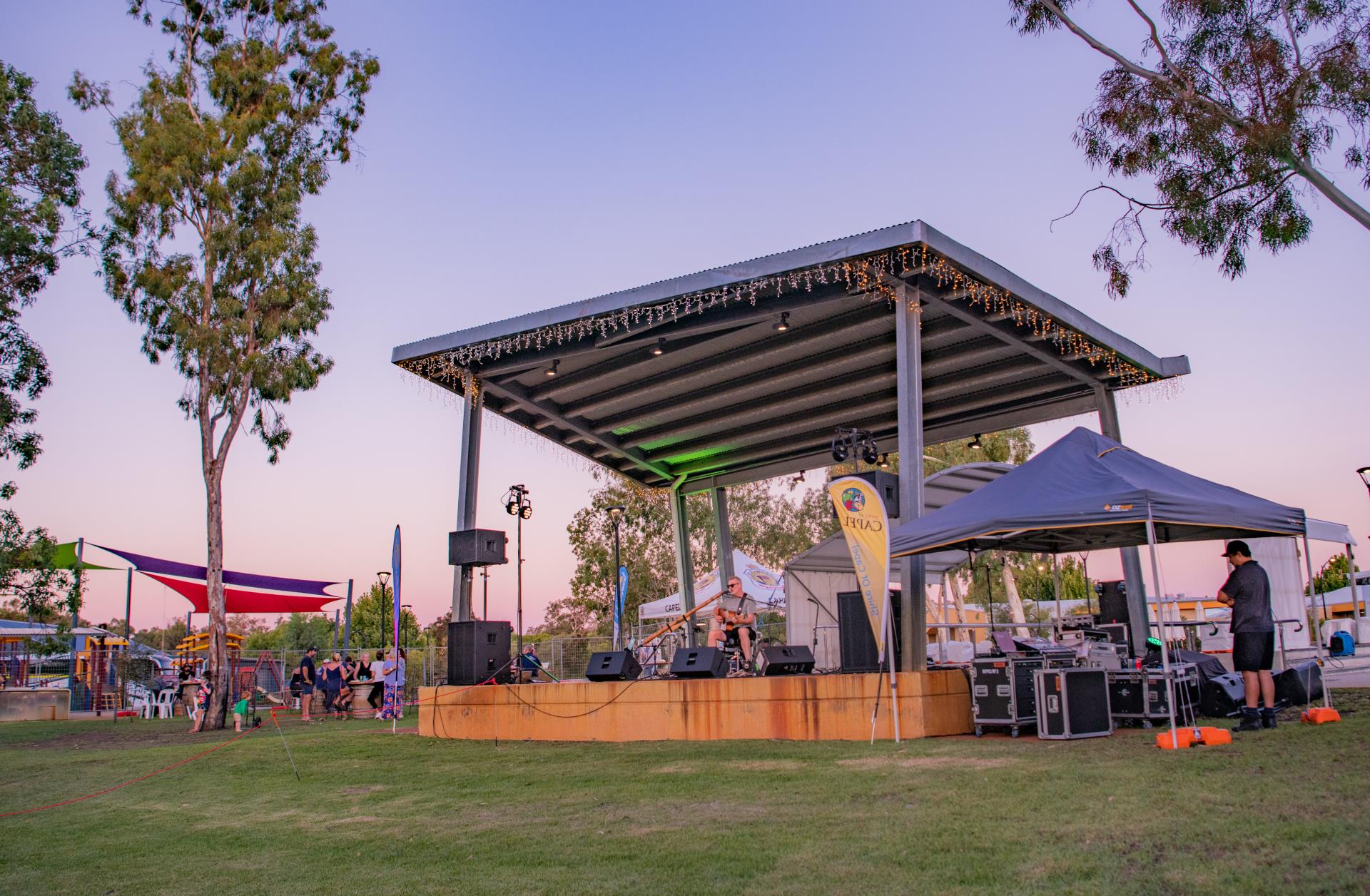 Gazebo with band playing in park ad fete