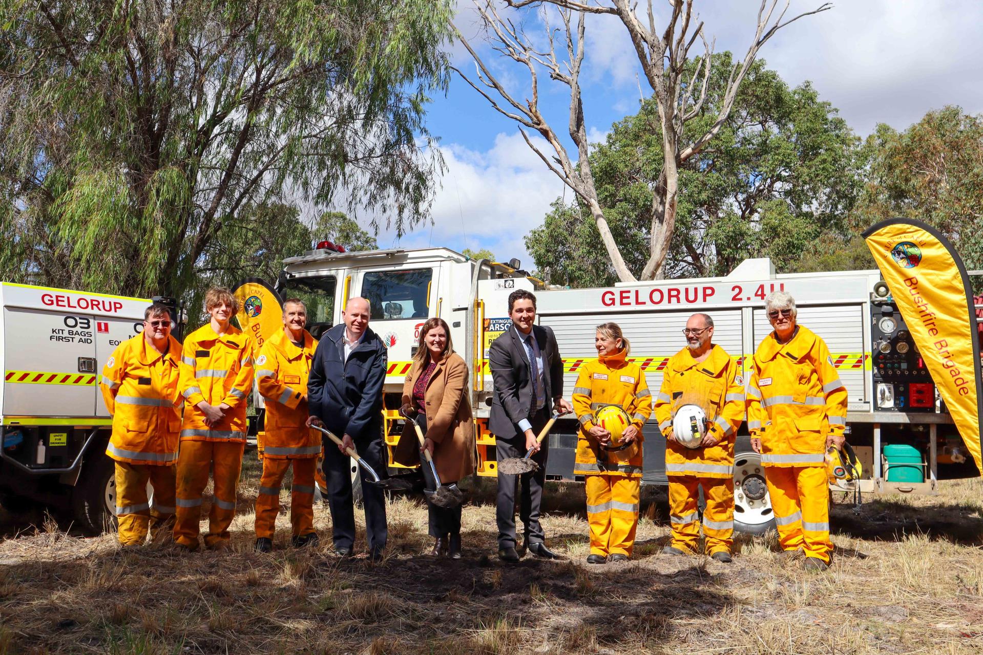Shire president Doung Kitchen and local MLA with Volunteer Fire Fighters digging ground