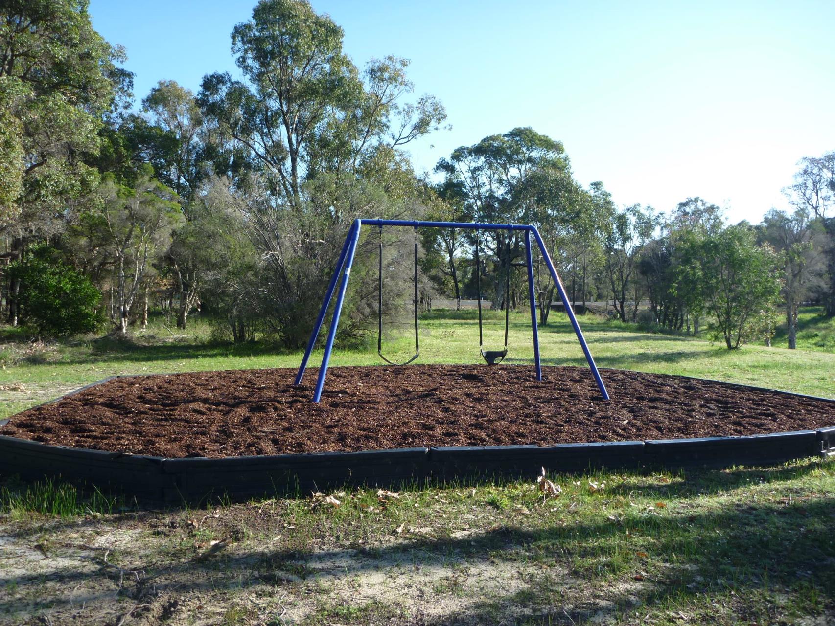 Swing set in open park